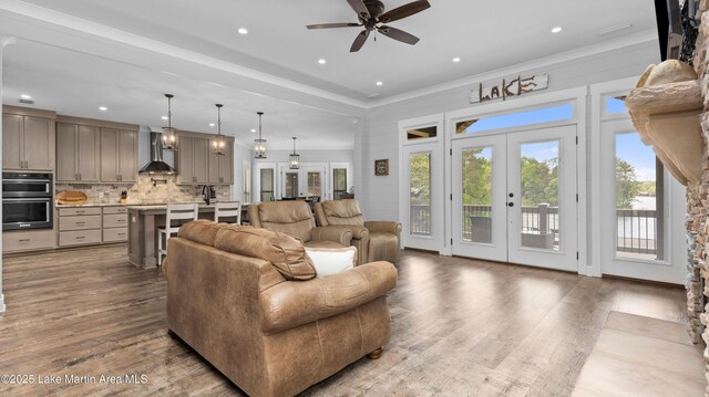 101 Mason Rd, Tallassee, AL 36078 - living room featuring a ceiling fan, dark wood-style flooring, french doors, and a healthy amount of sunlight