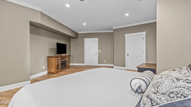 101 Mason Rd, Tallassee, AL 36078 - bedroom featuring wood finished floors, ornamental molding, recessed lighting, a fireplace, and baseboards