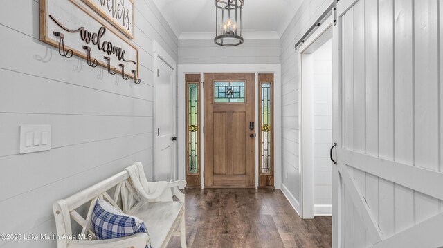 101 Mason Rd, Tallassee, AL 36078 - foyer with baseboards, ornamental molding, a barn door, and dark wood-style floors