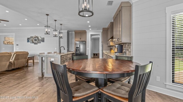 101 Mason Rd, Tallassee, AL 36078 - dining room with ornamental molding, visible vents, recessed lighting, light wood-style flooring, and baseboards