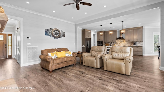 101 Mason Rd, Tallassee, AL 36078 - living room featuring a ceiling fan, crown molding, visible vents, and dark wood-type flooring