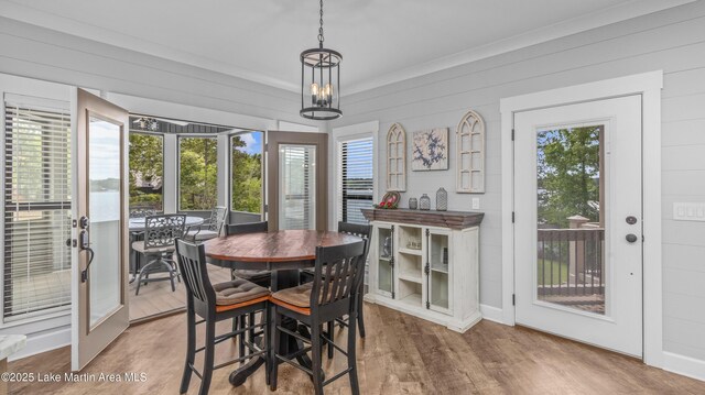 101 Mason Rd, Tallassee, AL 36078 - dining room featuring wood walls, wood finished floors, and ornamental molding