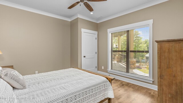 101 Mason Rd, Tallassee, AL 36078 - bedroom featuring baseboards, ornamental molding, ceiling fan, and wood finished floors