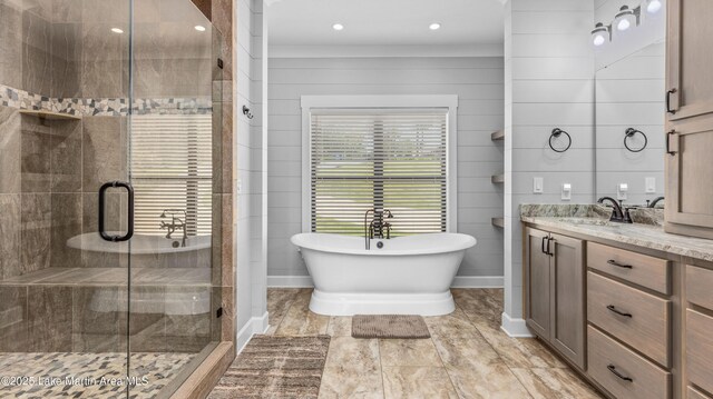 101 Mason Rd, Tallassee, AL 36078 - full bathroom with a stall shower, vanity, baseboards, and a soaking tub