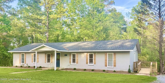 50 Omega Ln, Alexander City, AL 35010 - ranch-style house with a porch, a shingled roof, a front lawn, and gravel driveway