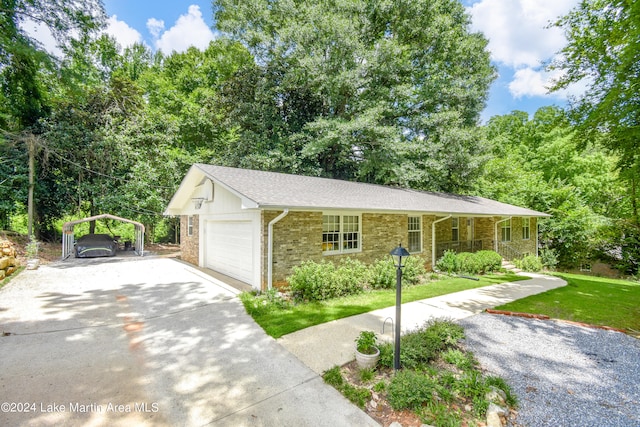 view of front of property with a front yard and a carport