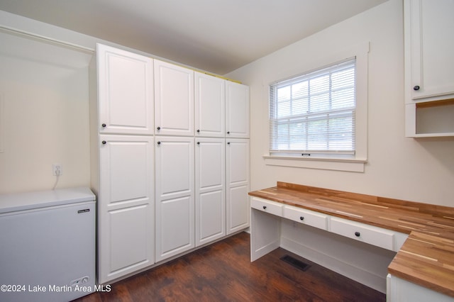 interior space with dark hardwood / wood-style floors