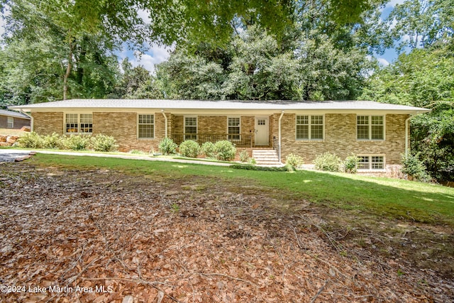 ranch-style house with a front lawn