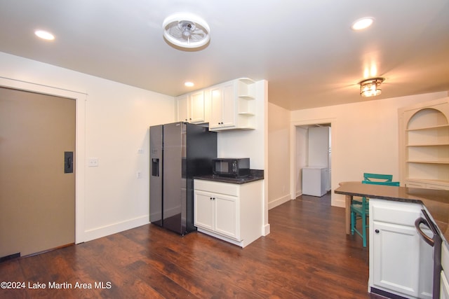 kitchen featuring appliances with stainless steel finishes, dark hardwood / wood-style floors, and white cabinetry