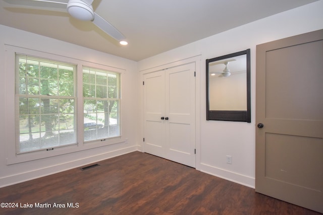 interior space featuring dark hardwood / wood-style floors and ceiling fan