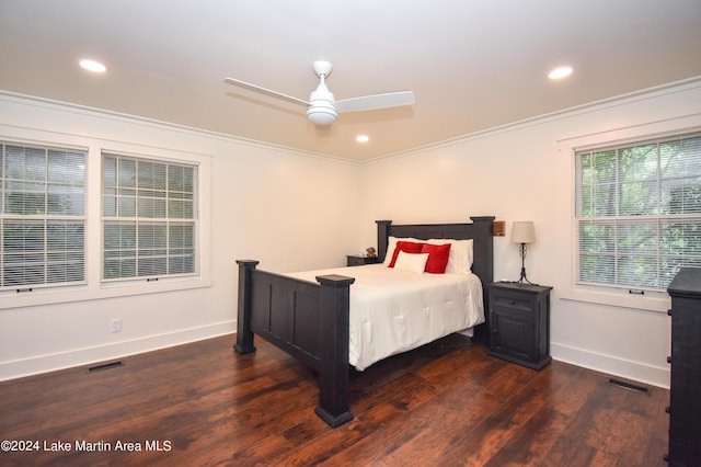 bedroom with ceiling fan, dark hardwood / wood-style floors, and ornamental molding