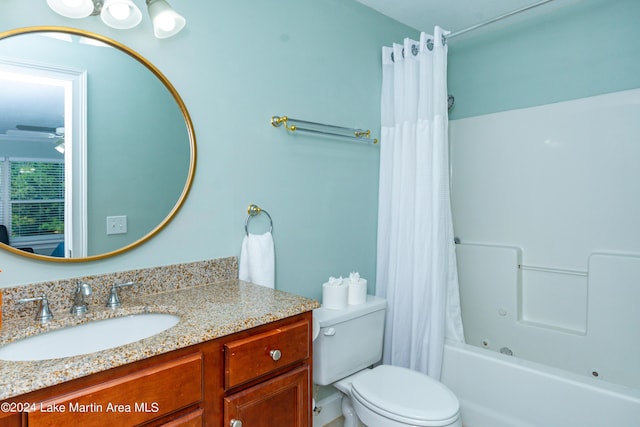 full bathroom with vanity, shower / bathtub combination with curtain, and toilet