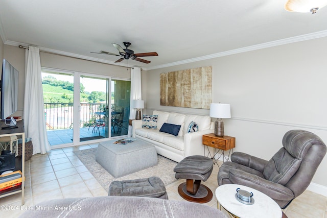 living room with ceiling fan, light tile patterned flooring, and ornamental molding