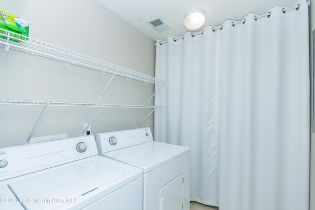 laundry area with washing machine and dryer