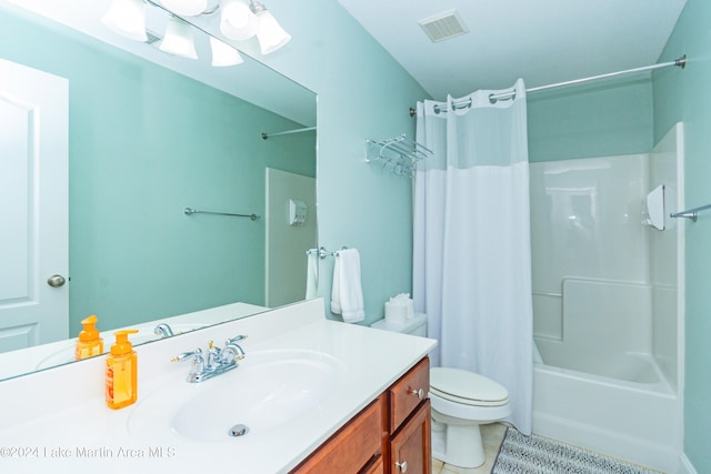 full bathroom featuring tile patterned floors, vanity, shower / bathtub combination with curtain, and toilet