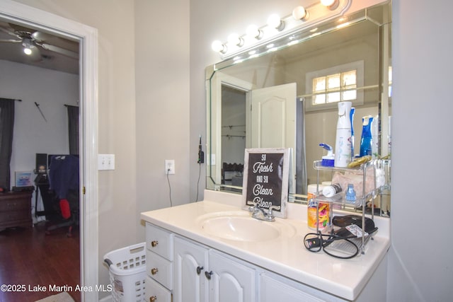 bathroom with vanity, wood finished floors, and a ceiling fan