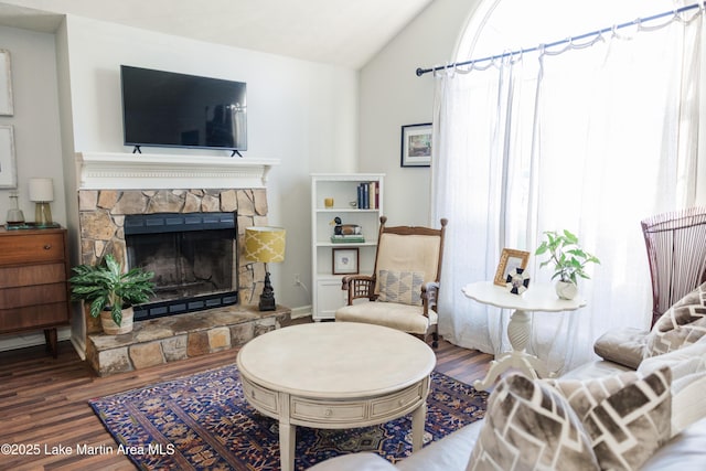 963 Birch Ct, Auburn, AL 36830 - living area with wood finished floors, vaulted ceiling, and a fireplace