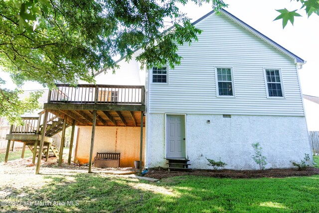 963 Birch Ct, Auburn, AL 36830 - rear view of house featuring a deck, stairway, a lawn, and stucco siding