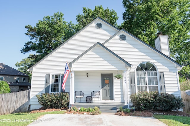 963 Birch Ct, Auburn, AL 36830 - view of front facade with a porch and a chimney