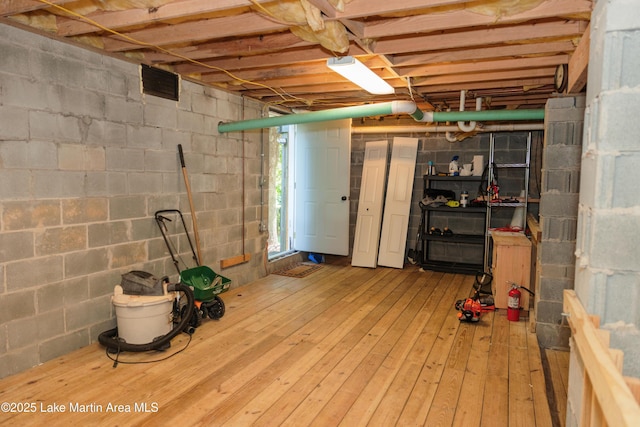 963 Birch Ct, Auburn, AL 36830 - below grade area featuring hardwood / wood-style floors and concrete block wall