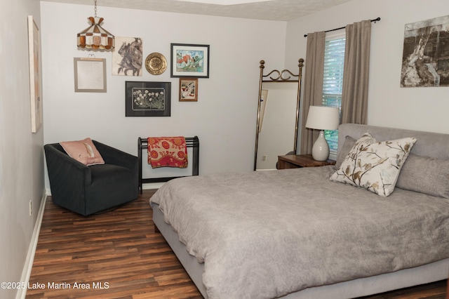 963 Birch Ct, Auburn, AL 36830 - bedroom featuring dark wood-type flooring and baseboards