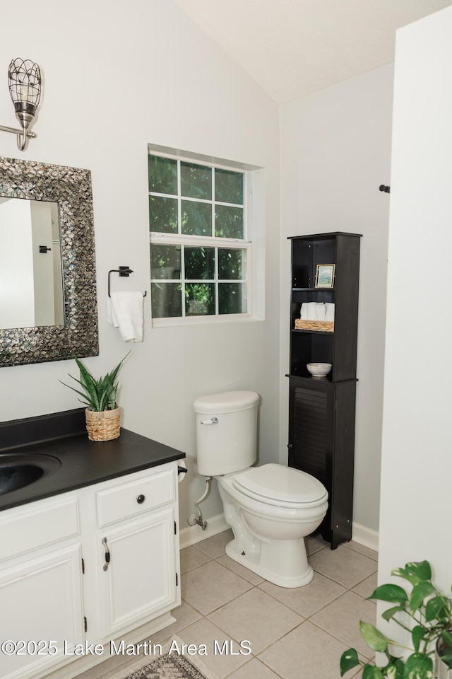 963 Birch Ct, Auburn, AL 36830 - bathroom featuring tile patterned floors, vanity, and lofted ceiling