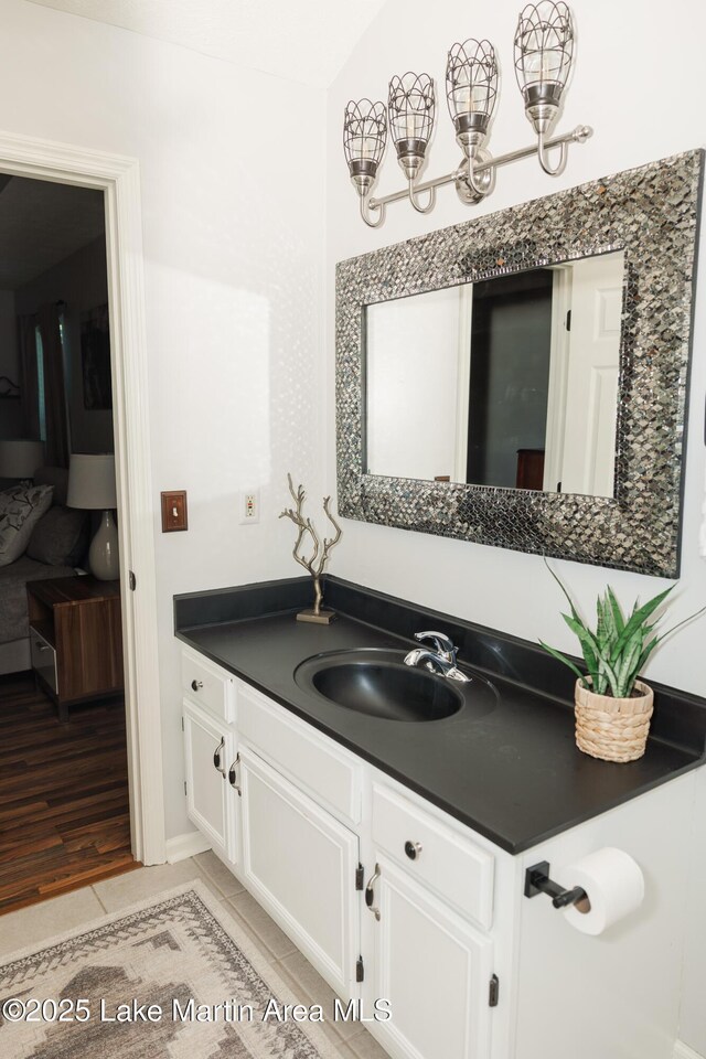 963 Birch Ct, Auburn, AL 36830 - bathroom featuring vanity, tile patterned floors, and a chandelier