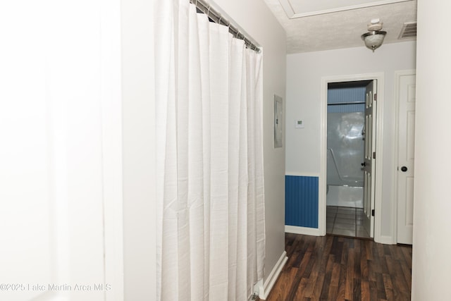 963 Birch Ct, Auburn, AL 36830 - hallway with dark wood-type flooring and electric panel