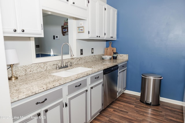 963 Birch Ct, Auburn, AL 36830 - kitchen featuring stainless steel dishwasher, dark wood-style floors, light stone countertops, and white cabinetry