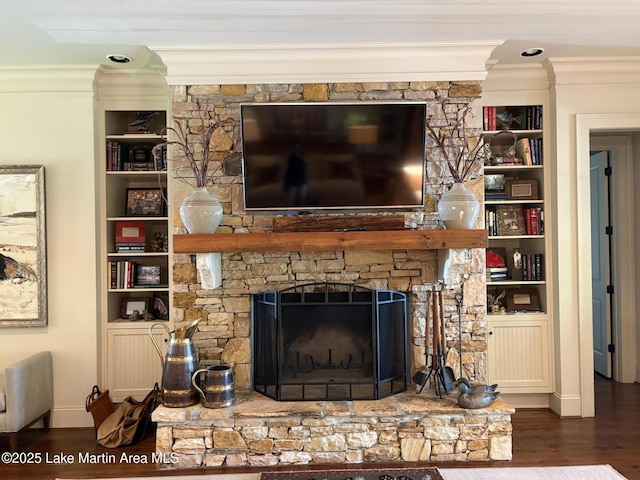 856 Windermere W Pkwy, Alexander City, AL 35010 - detailed view of crown molding, built in shelves, wood finished floors, and a stone fireplace