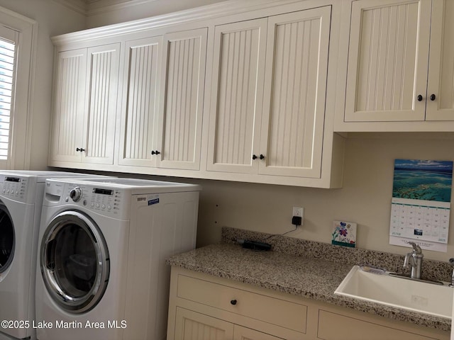 856 Windermere W Pkwy, Alexander City, AL 35010 - laundry area featuring cabinet space and washer and dryer