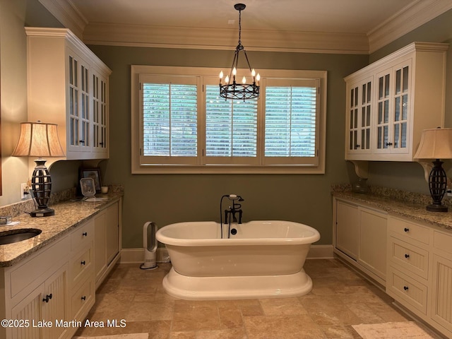 856 Windermere W Pkwy, Alexander City, AL 35010 - bathroom with a freestanding tub, a chandelier, and ornamental molding