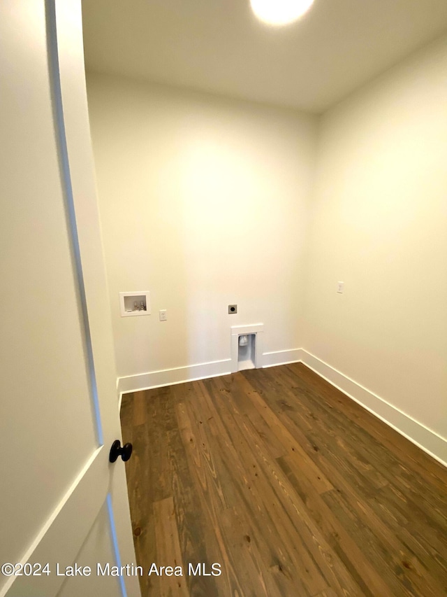 laundry room featuring dark hardwood / wood-style flooring, hookup for a washing machine, and hookup for an electric dryer