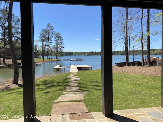 dock area featuring a yard and a water view