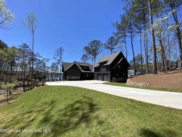 view of front of house featuring a garage and a front yard