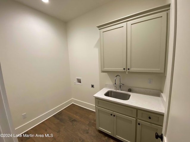 laundry room with sink, cabinets, dark hardwood / wood-style floors, electric dryer hookup, and washer hookup