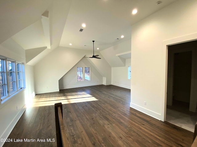 bonus room with vaulted ceiling, ceiling fan, and dark hardwood / wood-style flooring