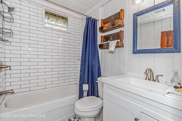 149 Lake Ridge Dr, Jacksons Gap, AL 36861 - bathroom featuring shower / bath combo with shower curtain, vanity, and toilet