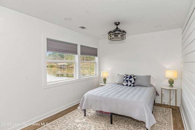 149 Lake Ridge Dr, Jacksons Gap, AL 36861 - bedroom featuring wood finished floors, baseboards, and visible vents