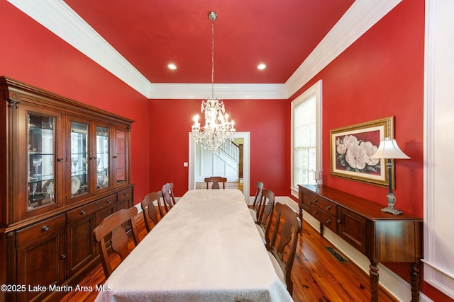 476 Pear Tree Rd, Auburn, AL 36830 - dining area with dark wood-style flooring, crown molding, a chandelier, and recessed lighting
