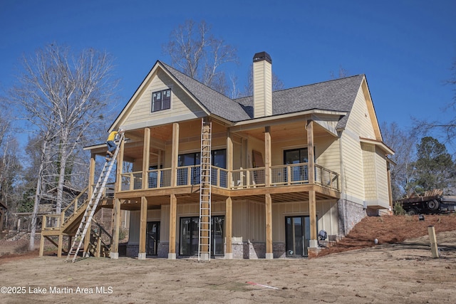 rear view of property with a balcony