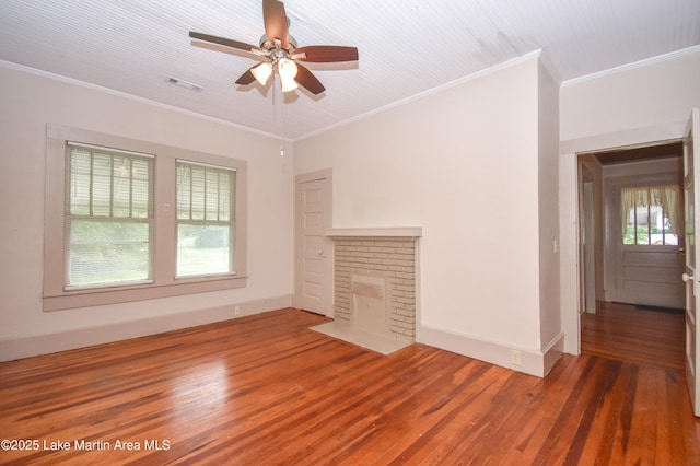 1330 Pearson Chapel Rd, Alexander City, AL 35010 - unfurnished living room featuring wood finished floors, ceiling fan, a brick fireplace, and crown molding