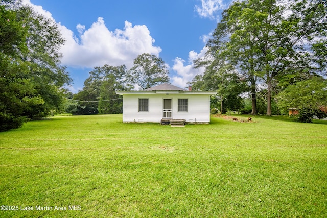 1330 Pearson Chapel Rd, Alexander City, AL 35010 - back of house featuring a yard and a chimney