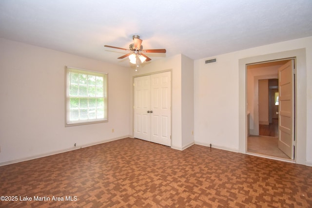 1330 Pearson Chapel Rd, Alexander City, AL 35010 - unfurnished bedroom featuring a closet and ceiling fan