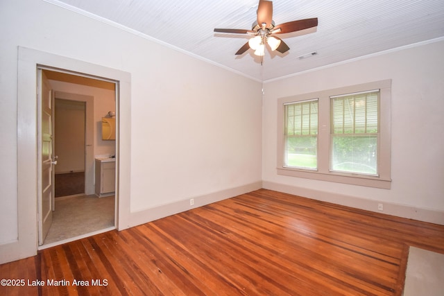 1330 Pearson Chapel Rd, Alexander City, AL 35010 - empty room with wood finished floors, a ceiling fan, and ornamental molding