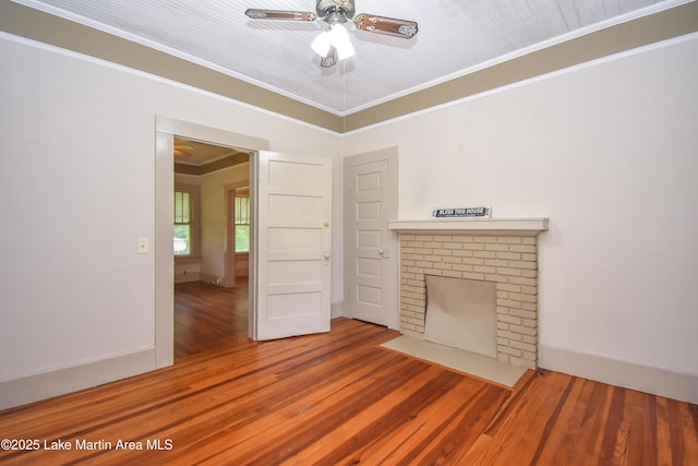 1330 Pearson Chapel Rd, Alexander City, AL 35010 - unfurnished living room with ornamental molding, a brick fireplace, wood finished floors, and ceiling fan