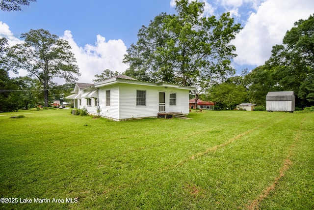 1330 Pearson Chapel Rd, Alexander City, AL 35010 - rear view of property featuring a shed and a yard
