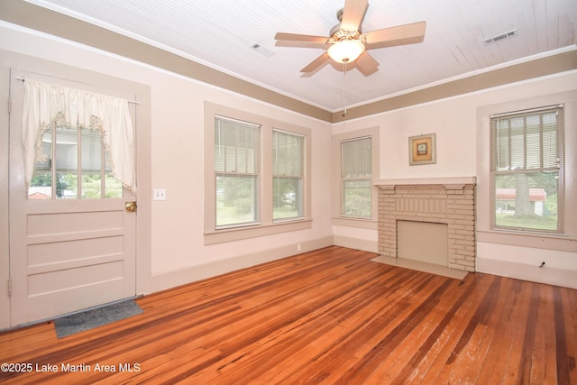 1330 Pearson Chapel Rd, Alexander City, AL 35010 - unfurnished living room featuring hardwood / wood-style flooring, ornamental molding, a ceiling fan, and a fireplace