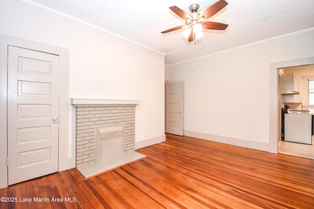 1330 Pearson Chapel Rd, Alexander City, AL 35010 - unfurnished living room featuring a ceiling fan, wood finished floors, ornamental molding, and a fireplace