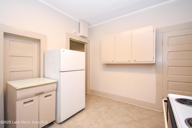 1330 Pearson Chapel Rd, Alexander City, AL 35010 - kitchen with white appliances, ornamental molding, light carpet, light countertops, and white cabinets